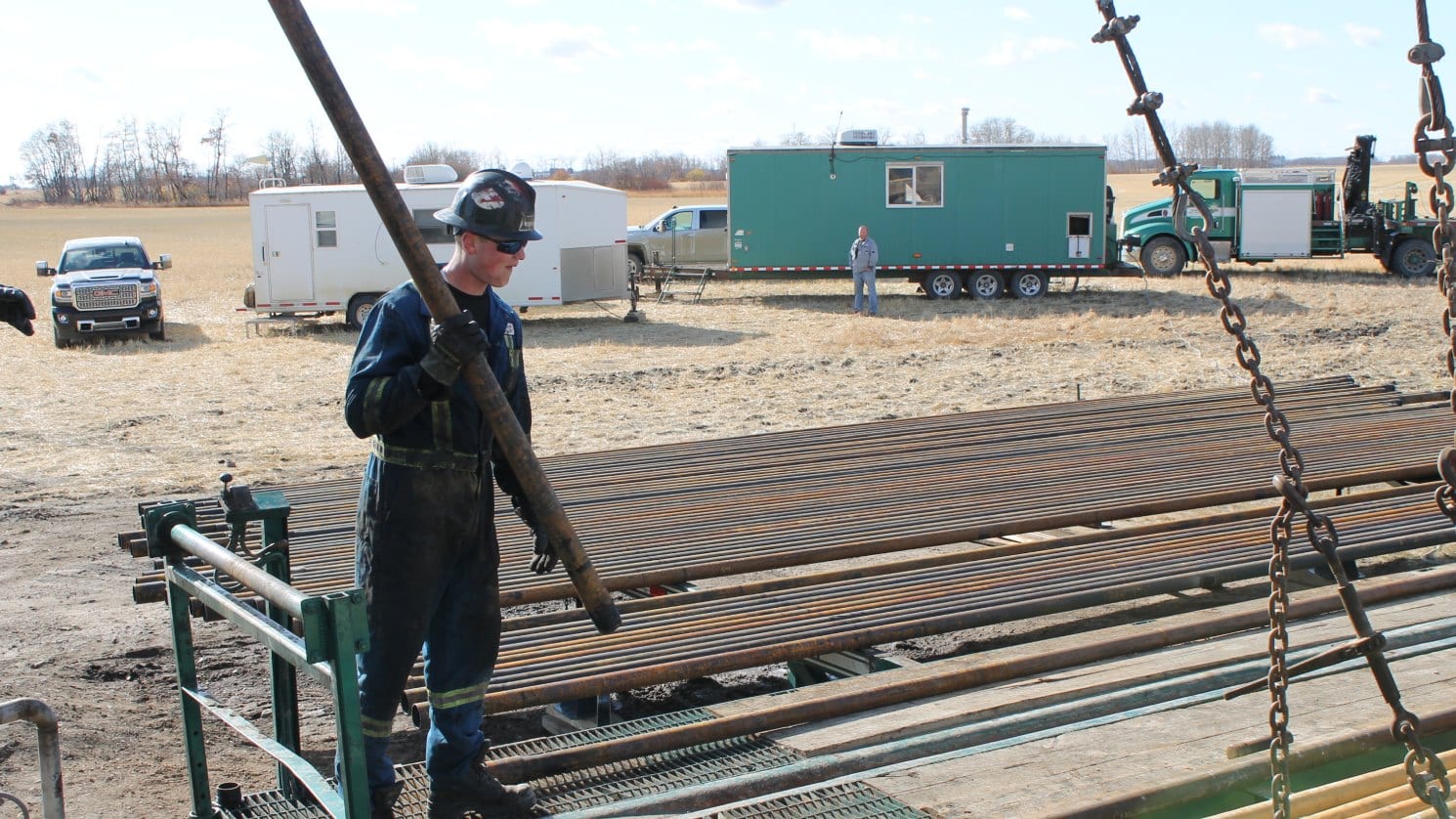 worker holding a metal
